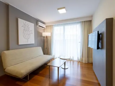a living room with a couch and a tv at B131 - Argentina in Cordoba