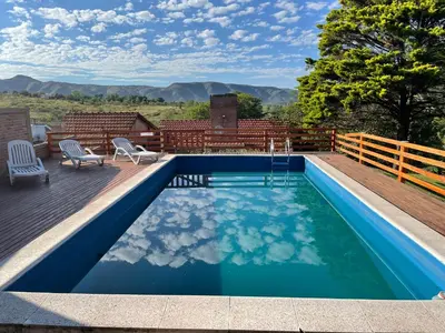 a swimming pool on the deck of a house at Casa El Descanso in San Antonio de Arredondo