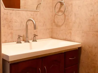 a bathroom with a white sink and a mirror at Casa El Descanso in San Antonio de Arredondo