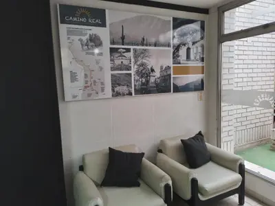 a living room with a couch and a window at Camino Real Hotel in Cordoba