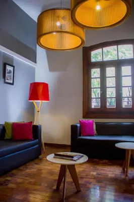 a living room with two couches and a table at Gran Rex Hotel in Cordoba