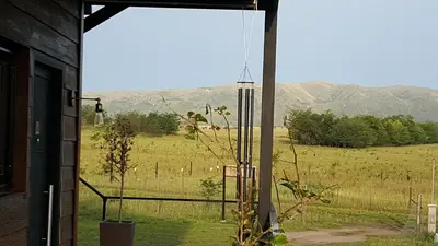 a view of a field from the porch of a house at Amatxi in Los Reartes