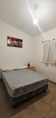 a bedroom with a bed in a room at Villa Elena Icho Cruz in Villa Icho Cruz