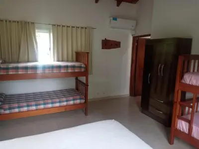 a room with two bunk beds and a window at El Maná in Bialet Massé