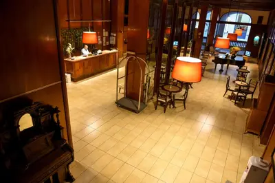 an overhead view of a lobby with chairs and tables at Hotel Sussex in Cordoba