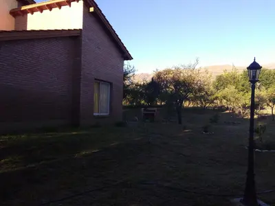 a house with a street light in the yard at Antiguo Molle in Merlo