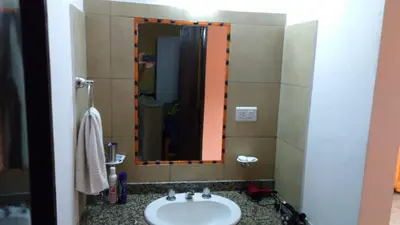 a bathroom with a sink and a mirror at Antiguo Molle in Merlo