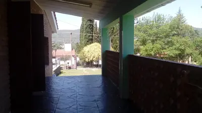 a view from the outside of a house with a balcony at Blacky House in Villa Carlos Paz