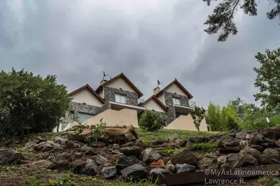 a house on top of a hill with rocks at Cabañas Alma de Pueblo, Mayu Sumaj in San Antonio de Arredondo