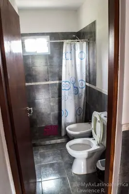 a bathroom with a toilet and a shower at Cabañas Alma de Pueblo, Mayu Sumaj in San Antonio de Arredondo