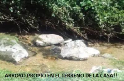 a video of a river with rocks and trees at Casa en La Cumbrecita in La Cumbrecita