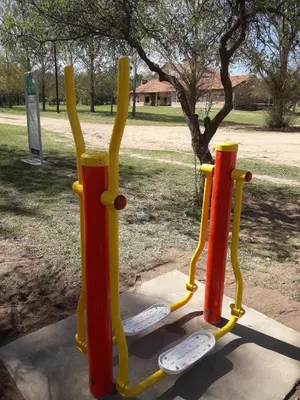a group of three play equipment in a park at Atahualpa mi Posada in Mina Clavero