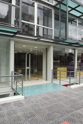 a building with a pool in the middle of a building at Espacio C Ambrosio Olmos in Cordoba