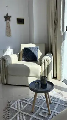 a living room with a couch and a table at Apart Riviera Tower Suites in Villa Carlos Paz