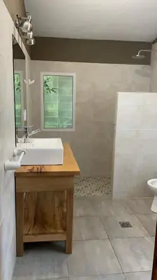a bathroom with a sink and a mirror at La Elina in Villa General Belgrano