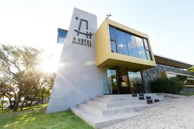 a building with stairs in front of a building at A Hotel Decosuites in Merlo