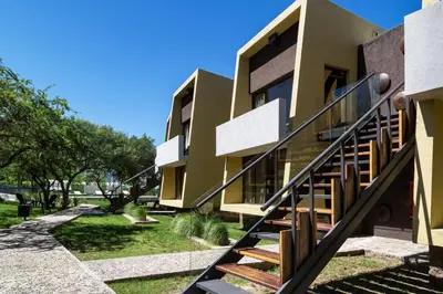 a building with stairs leading up to it at A Hotel Decosuites in Merlo