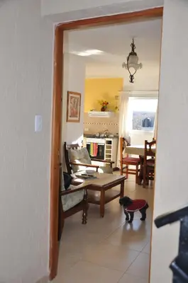 a living room with a cat sitting on the floor at Departamento de alquiler temporario in Villa Carlos Paz