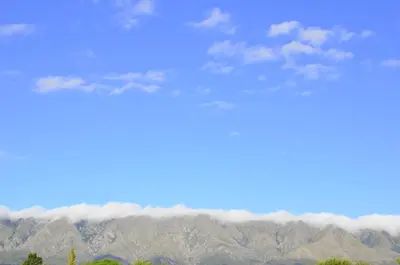 a view of the mountains with clouds in the sky at Rancho La Peregrina in Nono