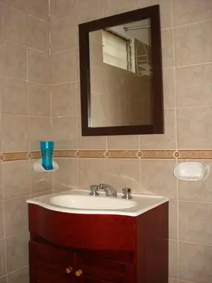 a bathroom with a sink and a mirror at Departamento carlos paz in Villa Carlos Paz