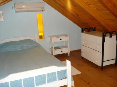 a bedroom with a bed and a dresser at Departamento carlos paz in Villa Carlos Paz