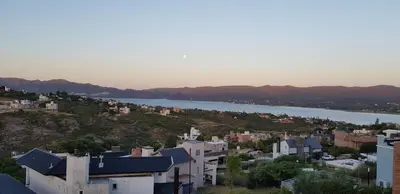 a view of a city and a body of water at Vivaldi Suites in Villa Carlos Paz