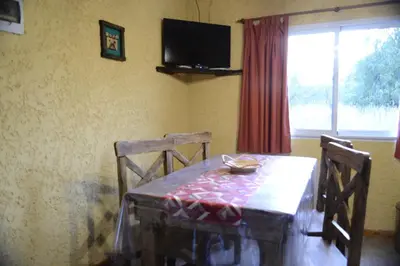 a dining room table with two chairs and a television at A Dolce Vita in Nono