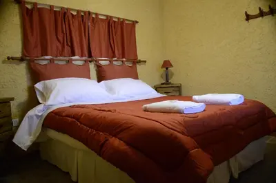 a bedroom with a bed with two towels on it at A Dolce Vita in Nono