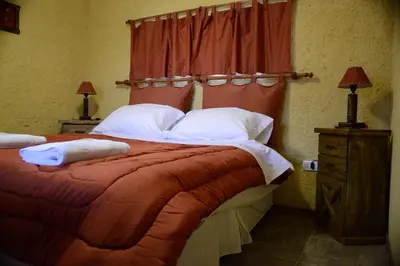 a bedroom with a large bed with a red headboard at A Dolce Vita in Nono