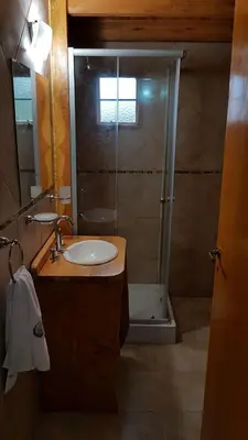 a bathroom with a shower and a sink at Brujas in Los Reartes