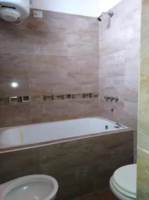 a bathroom with a tub and a toilet and a sink at Malvina in Villa Icho Cruz