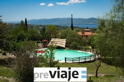 a swimming pool with a sign that reads preparedride at Capilla del Lago in Villa Carlos Paz