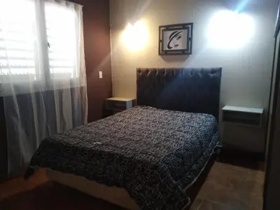 a bedroom with a bed and a window at Apartamento Nuevo Centro in Cordoba