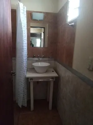 a bathroom with a sink and a mirror at Apartamento Nuevo Centro in Cordoba