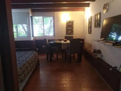 a room with a table and a dining room at Apartamento Nuevo Centro in Cordoba