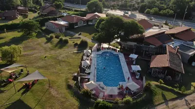 an overhead view of a swimming pool at a resort at Harmonie Hotel De Montaña - Adults only in Villa General Belgrano