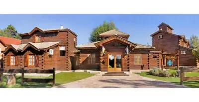 a large wooden house with at Posada Pfullendorf - Adults Only in Villa General Belgrano