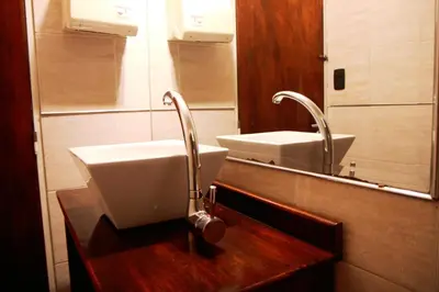 a bathroom with a sink and a mirror at Link Cordoba Hostel in Cordoba