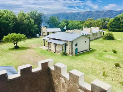 an aerial view of a house with a yard at Cabañas Misky Wayra in San Francisco del Monte de Oro