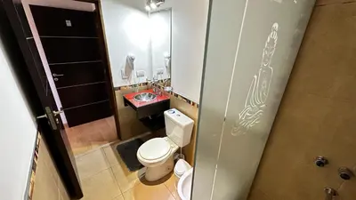 a small bathroom with a toilet and a sink at Complejo Riro Namaste in San Antonio de Arredondo