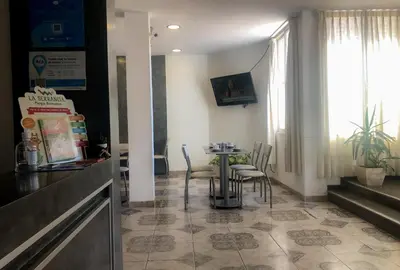 a dining room with a table and chairs at Hotel Bialet Massé in Bialet Massé