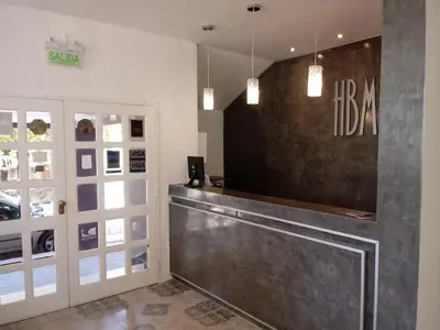 a lobby with a reception desk in a building at Hotel Bialet Massé in Bialet Massé
