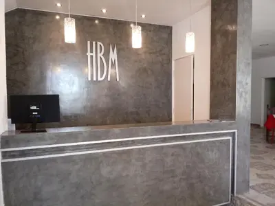 a lobby with a reception desk in a building at Hotel Bialet Massé in Bialet Massé