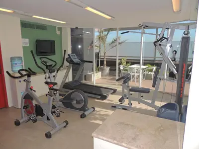 a gym with several exercise bikes in a room at King David Flat Hotel - Argentina in Cordoba