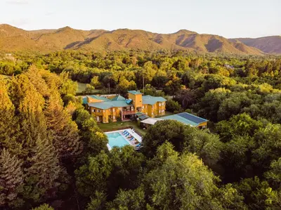 an aerial view of a house with a swimming pool at Posada Alma del Arroyo & Spa in Villa General Belgrano