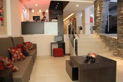 a living room with a staircase and a lobby at Sol de Piedra Apart, Suites & Spa in Cordoba