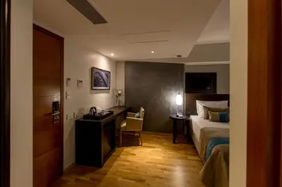a hotel room with a bed and a desk at Caseros 248 Hotel in Cordoba
