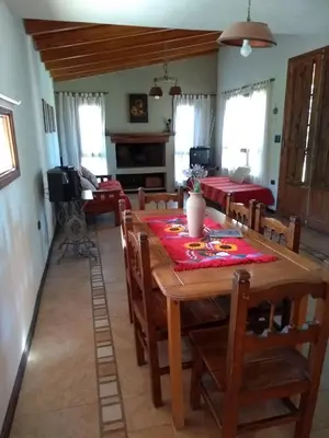 a dining room with a table and chairs at Hermosa casa en Potrero de Garay in Potrero de Garay