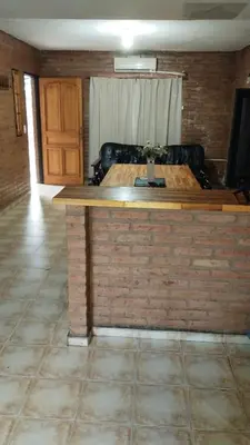 a living room with a table and a couch at casa villa suiza in Villa Carlos Paz