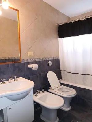 a bathroom with a toilet and a sink at casa villa suiza in Villa Carlos Paz
